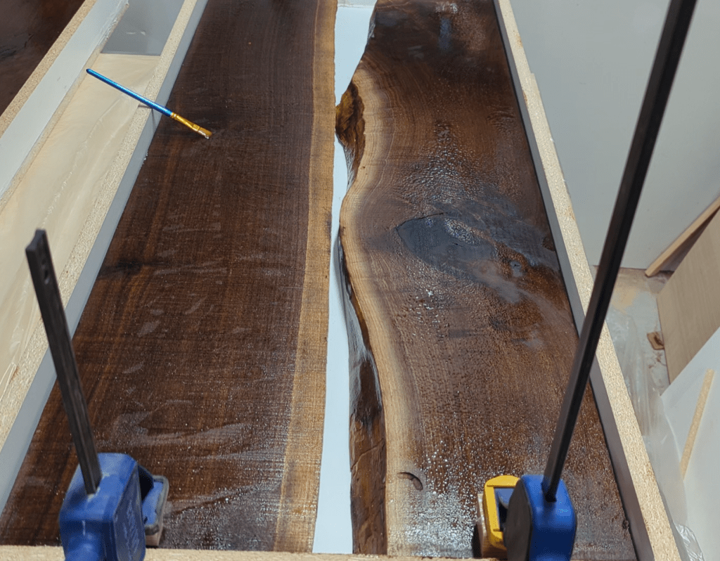 Behind the scenes view of the black walnut slabs before the epoxy was poured.